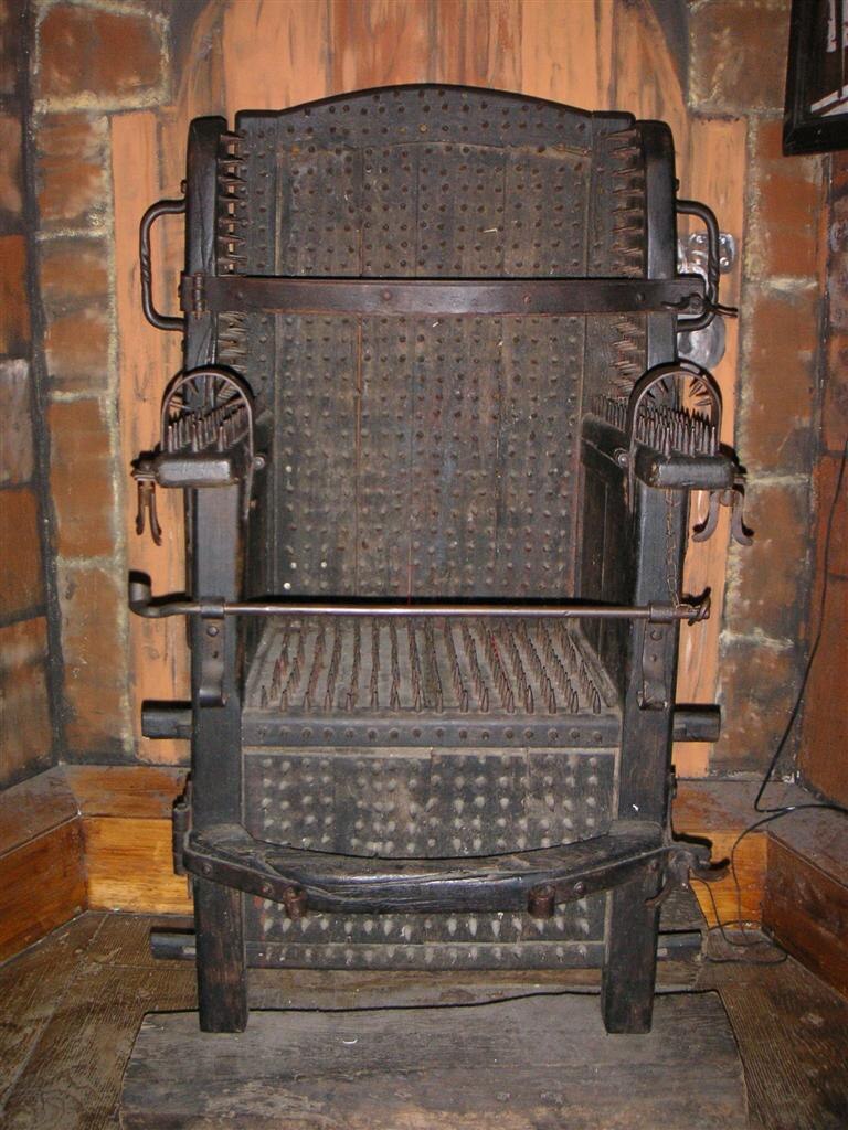 An iron chair displayed at the Torture Museum in Amsterdam. Wikipedia.